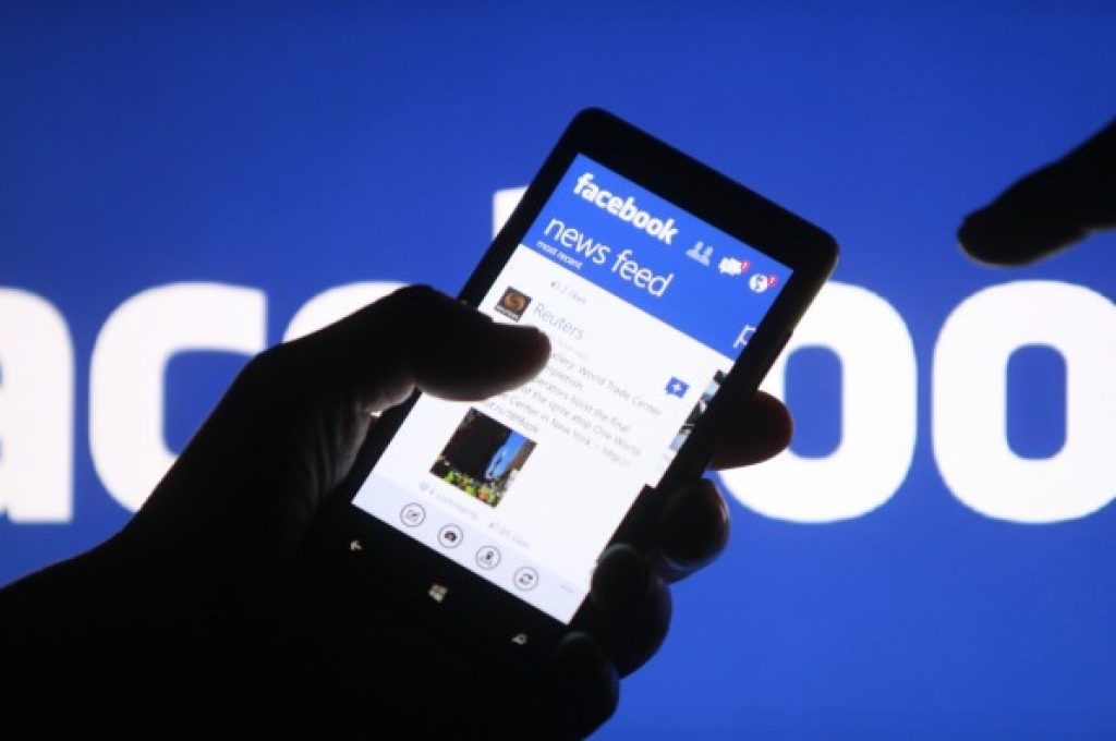 A smartphone user shows the Facebook application on his phone in Zenica, in this photo illustration