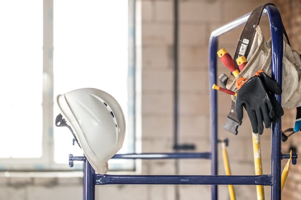 Working construction tool. Builder's accessories. House and house renovation concept background.